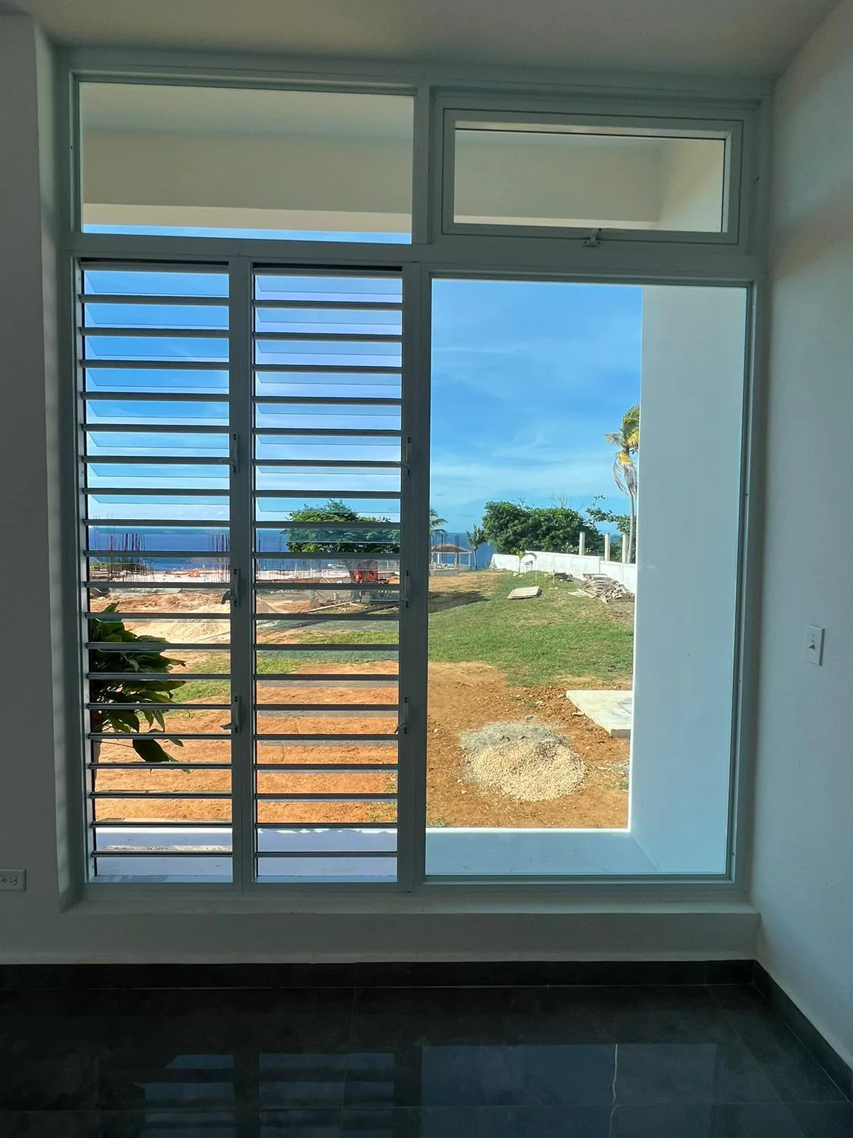 Sea view through glass louvers